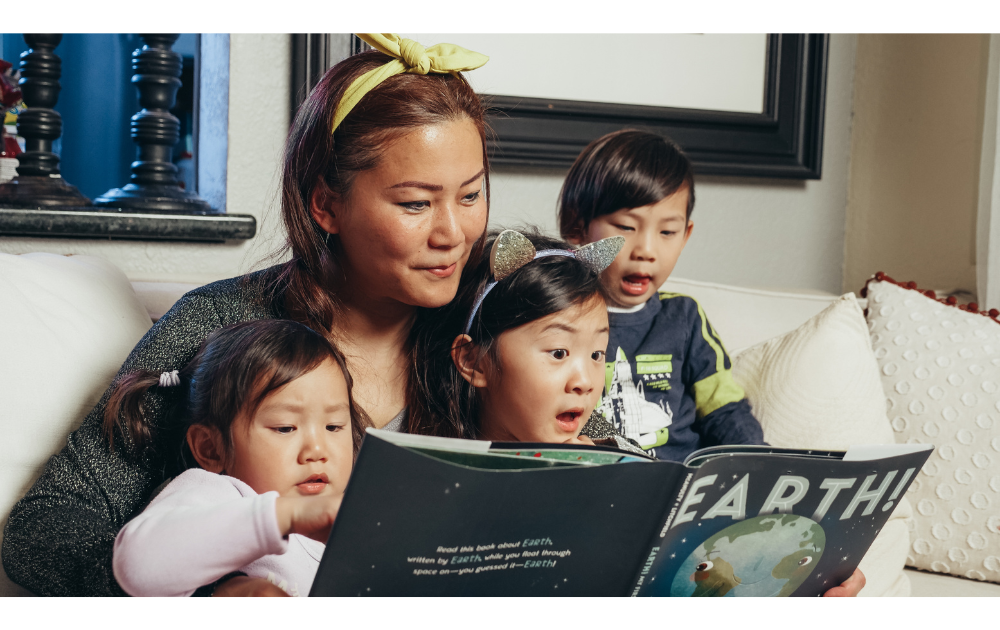 Mother reading with her kids