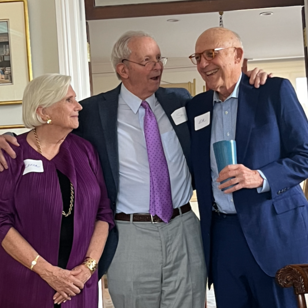 Community: Image of Sam Beard with associates at a networking event.