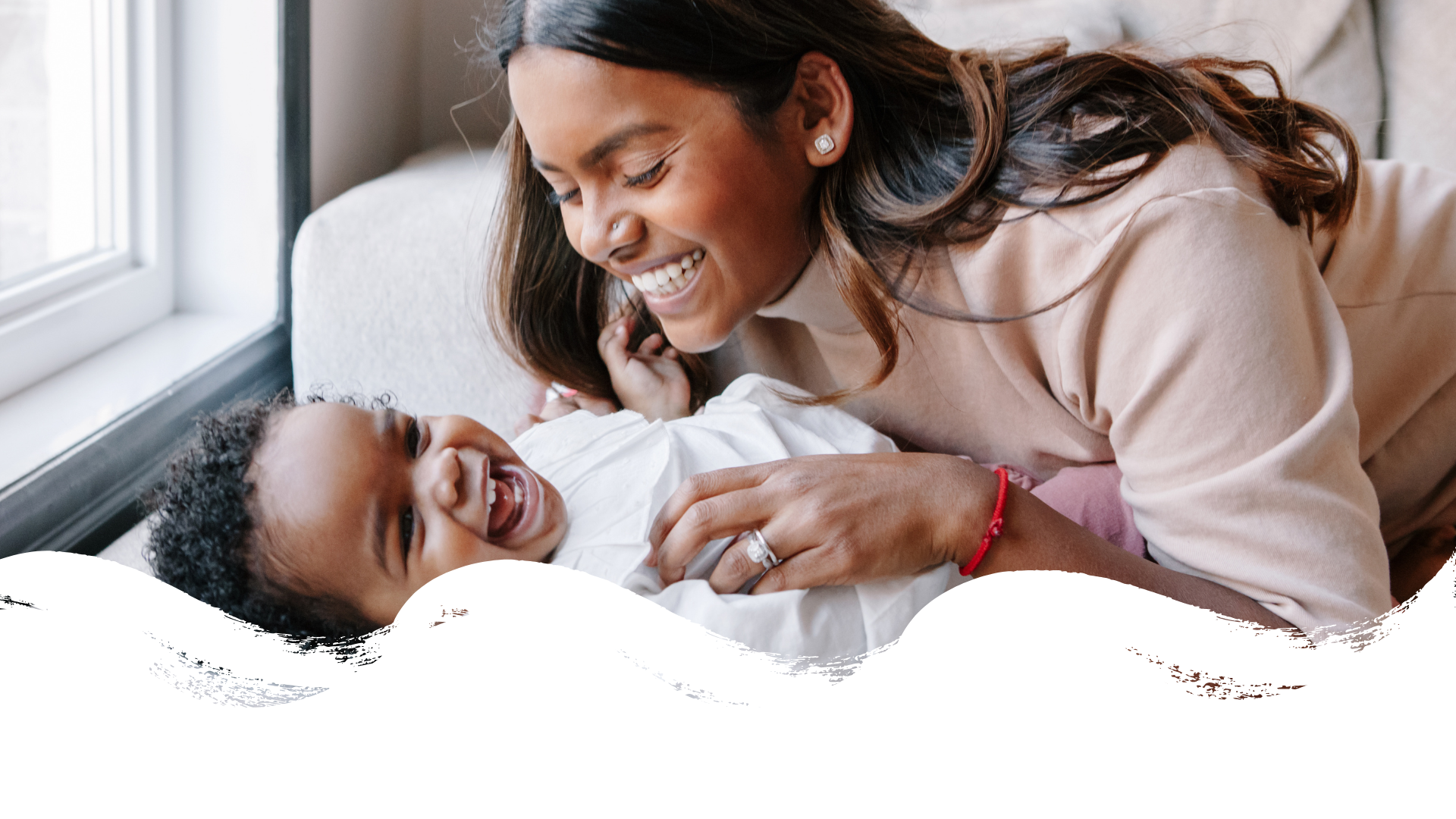 The science is clear - Image of young black mother laughing with her baby.