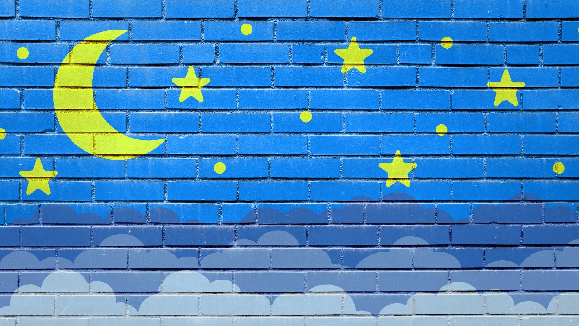 Technology tips: Image of a brick wall with stars and moon painter over the top.